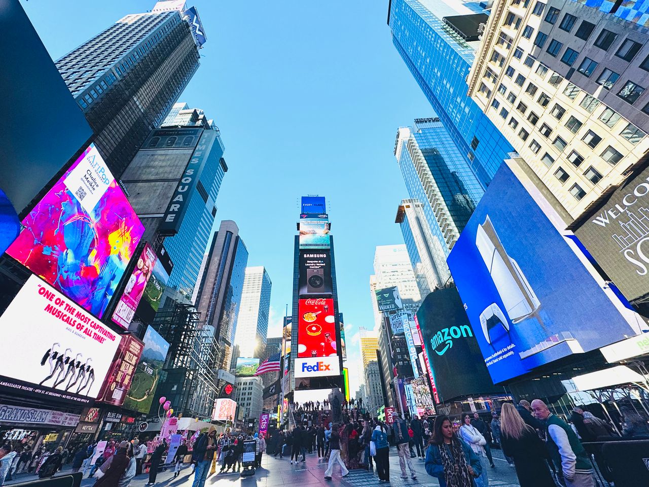 Digital billboards in a busy city square